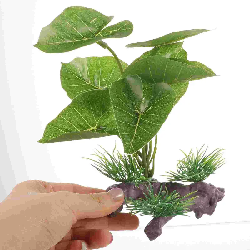 Decoration Plante artificielle réaliste pour aquarium, feuilles vertes et base imitation bois en plastique.